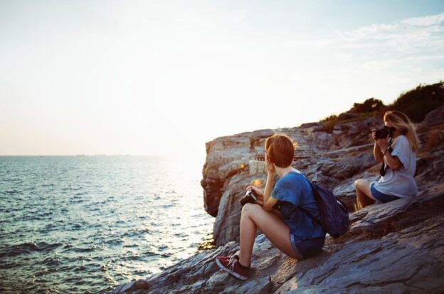 Woman enjoying a cove of rocks