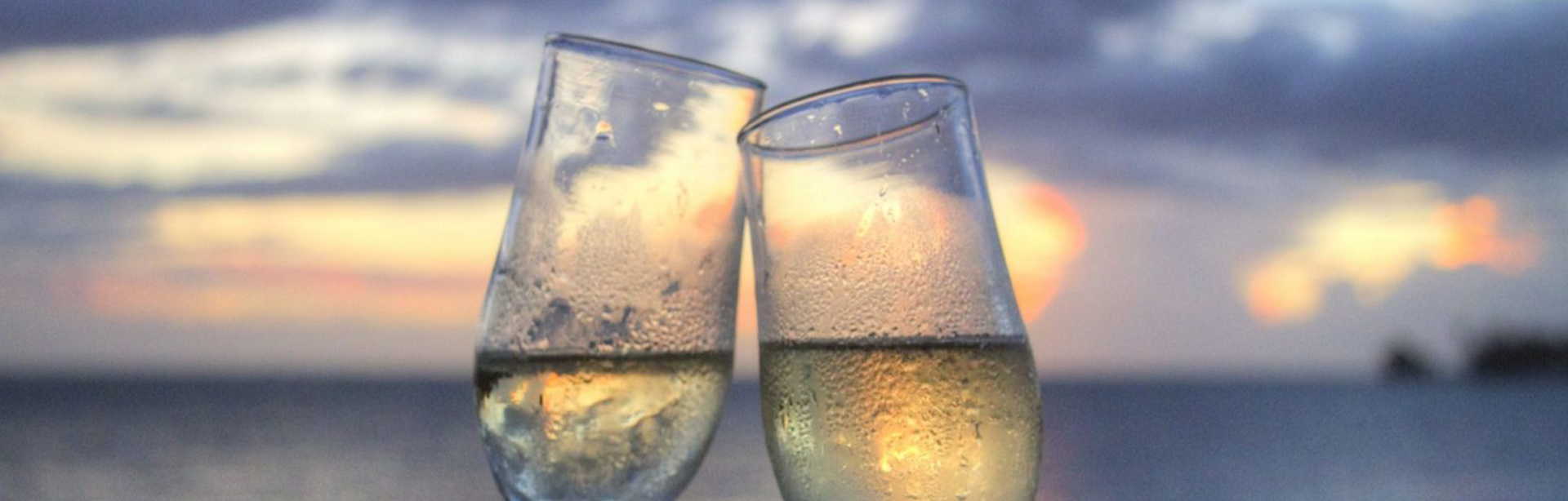 Cheering with champagne in the beach