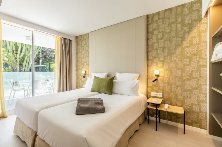 Bright exterior bedroom at Hoposa Illa d'Or Apartments