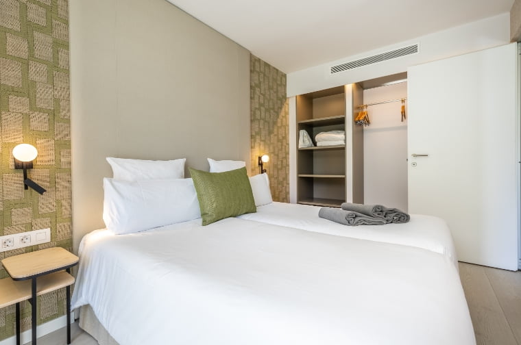 Side view of the bedroom, with a large wardrobe at the back