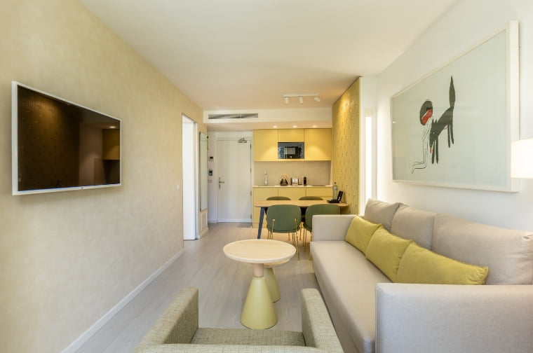 Living room of the apartment with kitchen at the back