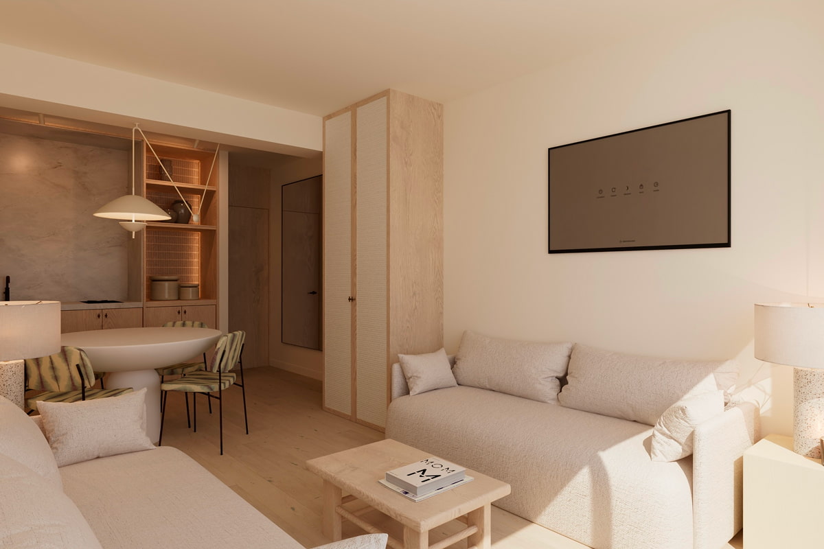 Zona de estar con dos sofás y mesa baja en apartamento