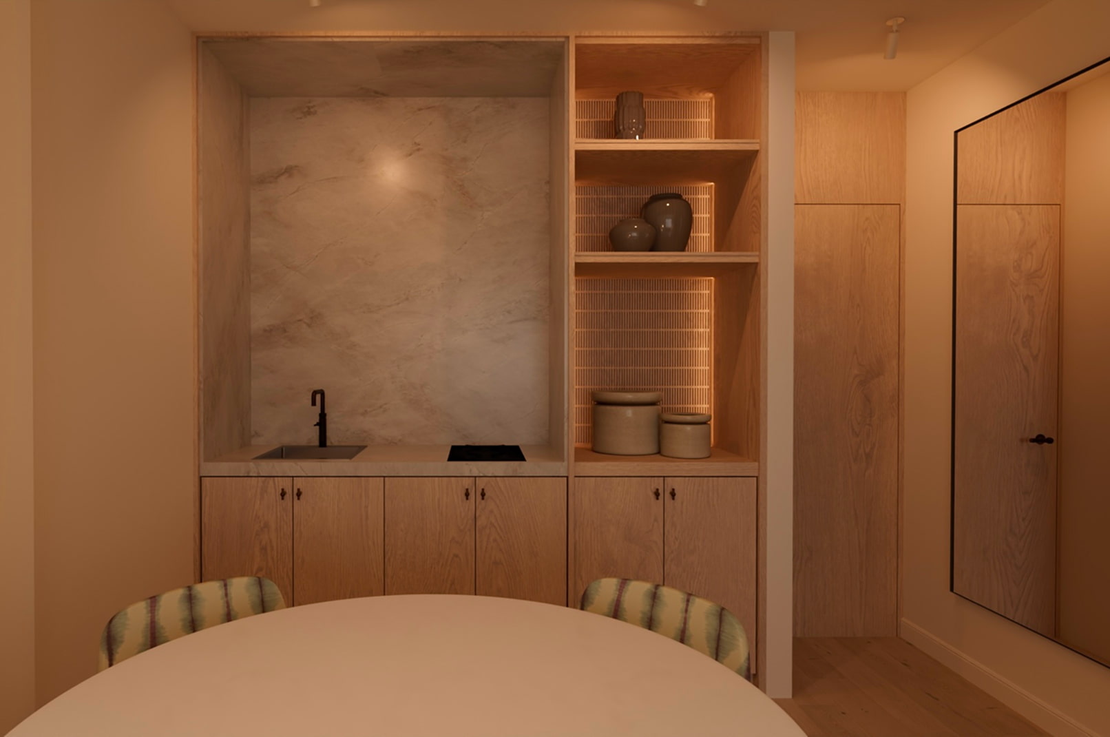 Cocina abierta con estanterías y acabados en madera del apartamento premium